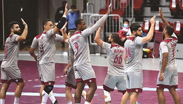 Qatar players celebrate after beating Argentina in a friendly international tournament held in Doha last December.