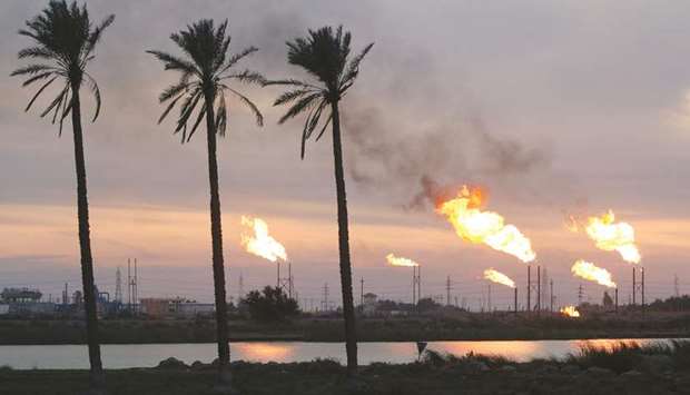 Flames emerge from flare stacks at the oil fields in Basra (file). Crude shipments from Iraq, the second largest producer in Opec, rose 4% last month to 3.26mn barrels a day, according to tanker-tracking and port-agent data compiled by Bloomberg.