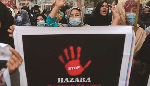 Hazaras chanting slogans during a protest against the killing of miners from their community, who were murdered in an attack by gunmen in the mountainous Machh area, in Karachi yesterday. (AFP)