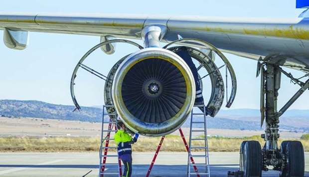 A mechanic works on a passenger aircraft engine at Teruel Airport in Teruel, Spain. According to IATA, losses incurred by airlines will total about $120bn in 2020 and another $40bn in 2021.