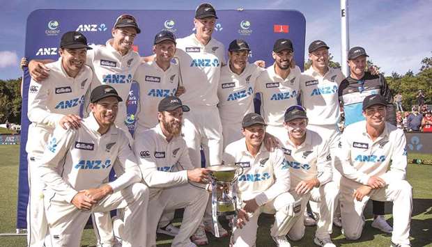 New Zealand players celebrate after the second Test against Pakistan at Hagley Oval in Christchurch yesterday. (Right) New Zealandu2019s paceman Kyle Jamieson in action. (AFP)