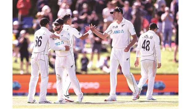 New Zealandu2019s Kyle Jamieson (second right) celebrates with teammates on day four of the second Test against Pakistan at Hagley Oval in Christchurch on Wednesday. (AFP)