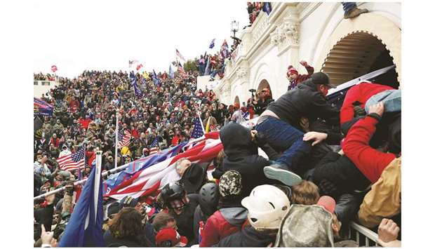 Pro-Trump protesters storm into the US Capitol during clashes with the police during a rally to contest the certification of the 2020 presidential election results by the US Congress in Washington on Wednesday. (Reuters)