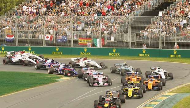 In this March 25, 2018, picture, cars go around the first corner at the start of the Australian GP at the Melbourne Grand Prix Circuit. (Reuters)