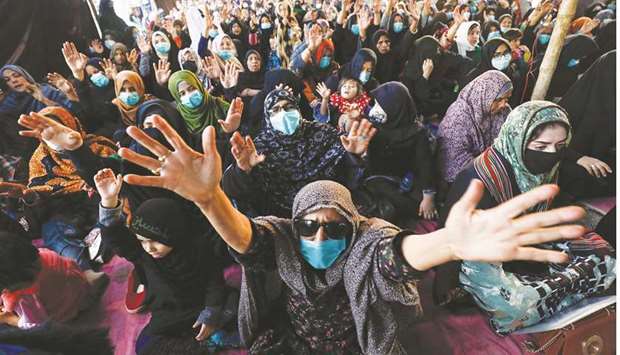 People chant slogans demanding justice at a protest yesterday in Karachi, following the killings of coal miners from the Shia Hazara minority in an attack in Machh.