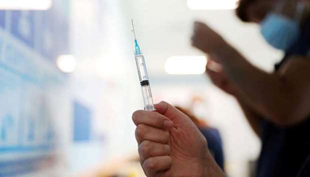 A nurse prepares a dose of the Pfizer/BioNtech vaccine against the coronavirus disease at the Posta Central hospital in Santiago, Chile December 24, 2020