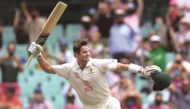 Steve Smith of Australia celebrates reaching his century during day two of the third Test match against India at the SCG yesterday.