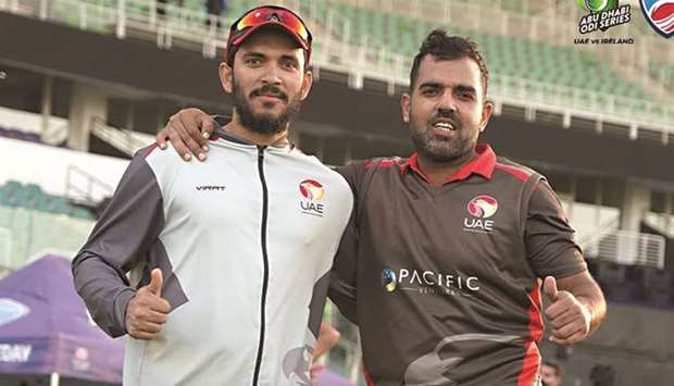 Chundangapoyil Rizwan (L) and Mohammad Usman pose after UAEu2019s win over Ireland on Friday.