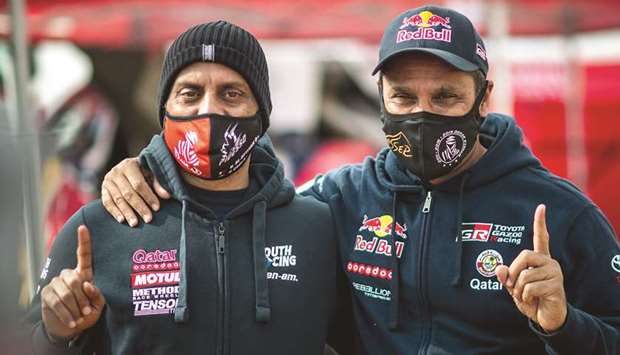 Nasser al-Attiyah (right) with his younger brother Khalifa al-Attiyah as the two Qataris enjoy the rest day at the Dakar Rally yesterday.