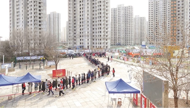 People line up for nucleic acid testing during a citywide mass testing for the coronavirus (Covid-19) disease after local cases of the Omicron variant were detected in Tianjin.