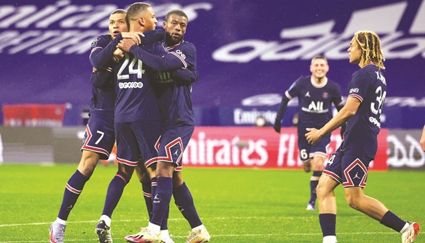 Paris St Germainu2019s Thilo Kehrer (second left) celebrates with teammates after scoring against Lyon in the Ligue 1 at the Groupama Stadium in Lyon, France. (Reuters)