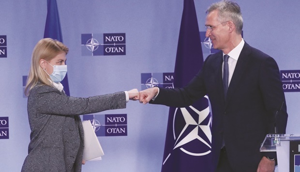 Nato Secretary-General Jens Stoltenberg and Ukrainian Deputy Prime Minister for European and Euro-Atlantic integration Olga Stefanishyna fist bump after a joint news conference following a meeting at the Allianceu2019s headquarters in Brussels yesterday. (Reuters)