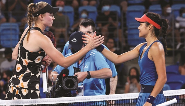 Elena Rybakina (left) of Kazakhstan shakes hands with Emma Raducanu of Britain after their match at the Sydney Classic. (AFP)