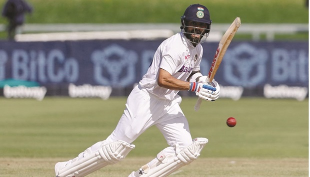 Indiau2019s Virat Kohli watches the ball after playing a shot during the first day of the third Test against South Africa at Newlands stadium in Cape Town yesterday. (AFP)