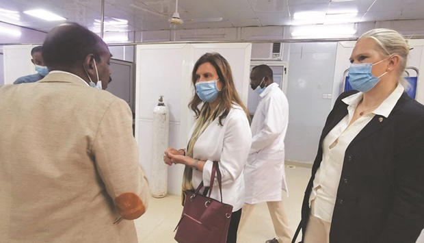 Norwegian ambassador to Sudan Therese Loken Gheziel and Swedish ambassador to Sudan Signe Burgstaller talk with director of Khartoum Teaching Hospital Elfatih Abdallah, following reports of attacks by security forces against the hospital, in Khartoum.