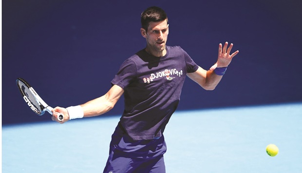 Novak Djokovic of Serbia hits a return during a practice session ahead of the Australian Open in Melbourne yesterday. (AFP)