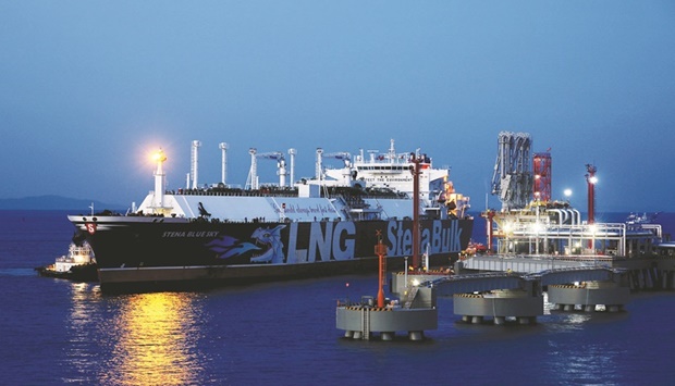 An LNG tanker is seen at the liquefied natural gas terminal owned by Chinese energy company ENN Group in Zhoushan, Zhejiang province, China (file). LNG spot rates from Asia to Europe surged to records in 2021 as supply struggled to keep pace with the demand rebound from the depths of the pandemic.