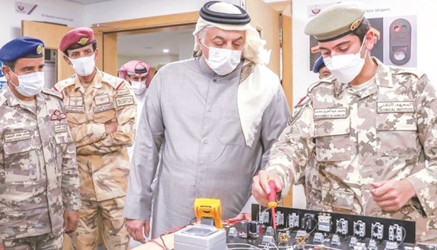 Deputy Prime Minister and Minister of State for Defence Affairs Dr Khalid bin Mohamed al-Attiyahinspecting the facilities at the new Armed Forces Technical Institute facilities.