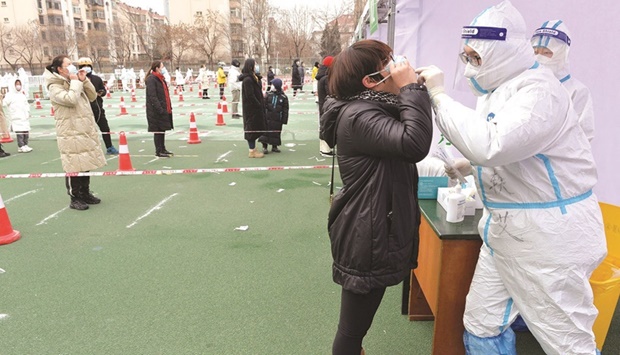 A resident undergoes a nucleic acid test for the Covid-19 in Tianjin.