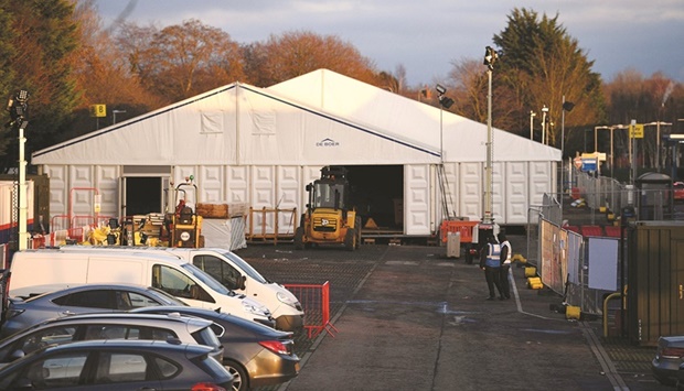 Construction of a temporary field hospital, a Nightingale u2018surge hubu2019 is seen taking place in the grounds of The Royal Preston Hospital, in north-west England, as fuelled by the highly contagious Omicron variant, daily cases of Covid-19 are rising in the north. The u201csurge hubsu201d will deal with a potential overspill of inpatients as surging virus cases put the countryu2019s health service on a u201cwar footingu201d, according to officials.