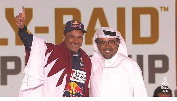 Nasser al-Attiyah celebrates with Qatar Motor and Motorcycle Federation  President Abdulrahman Abdulatif al-Mannai in Jeddah yesterday