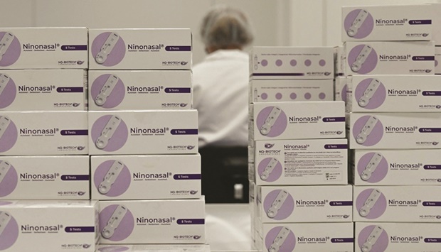 Boxes of Covid-19 self tests are pictured at French biotech company NG Biotech in Guipry-Messac, France on January 13. Itu2019s inevitable that governments will eventually need to regard Covid as one of many public health challenges that can be managed u2014 rather than one requiring the urgency and focus devoted since early 2020.