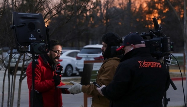 A TV crew reports in the area where a man has reportedly taken people hostage at a synagogue during services that were being streamed live, in Colleyville, Texas, US January 15. REUTERS