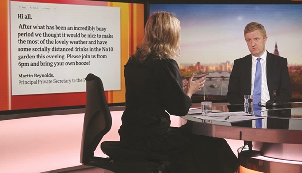 A handout picture released by the BBC, taken and received yesterday, shows Britainu2019s Conservative party chairman Oliver Dowden on the BBCu2019s Sunday Morning political television show with journalist Sophie Raworth.