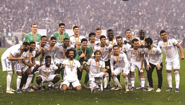Real Madrid players celebrate winning the Spanish Super Cup final against Athletic Bilbao at the King Fahd International Stadium in the Saudi capital of Riyadh. Real Madrid won 2-0 as Luka Modric and a Karim Benzema penalty secured a comfortable victory in Saudi Arabia. (AFP)