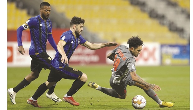 Al Sailiyau2019s Magdi Musa (left) and teammate Ahmed Yasser chase Al Duhailu2019s Paulo Da Silva Edmislon (right) during their QNB Stars League match at the Suheim Bin Hamad Stadium in Doha on Monday. The match ended in a 1-1 draw.