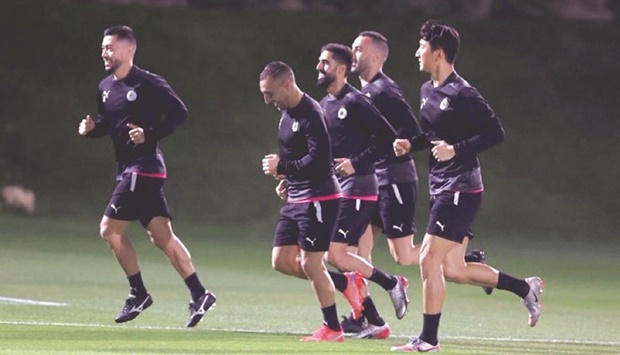 Al Sadd players in action during a training session.
