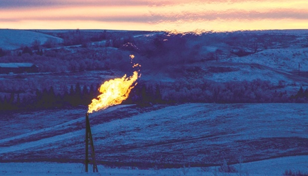 A natural gas flare on an oil well pad burns as the sun sets outside Watford City, North Dakota (file). Brent crude futures rose by $0.74, or 0.9%, to $87.22 a barrel at 1446 GMT yesterday, while US West Texas Intermediate (WTI) crude futures jumped $1.07, or 1.3%, to $84.89.