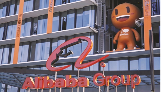 The Alibaba Group logo is seen at its headquarters in Hangzhou, Zhejiang province, China (file). Alibaba, the worldu2019s fourth largest cloud provider according to research firm Canalys, has about 4mn customers and describes its cloud business as its u201csecond pillar of growth.u201d It saw a 50% rise in revenue to $9.2bn in 2020, though the division accounts for just 8% of overall sales.