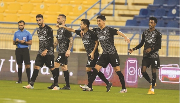Al Saddu2019s Rodrigo Tabata (third from right) celebrates with teammates after scoring against Al Shamal during their QNB Stars League match yesterday.