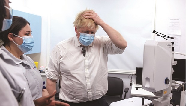 Britainu2019s Prime Minister Boris Johnson gestures during a visit at the Finchley Memorial Hospital, an NHS (National Health Service) community hospital, in North London.