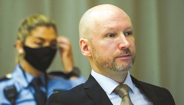 Anders Behring Breivik (right) on the first day of the trial where he is requesting release on parole, yesterday at a makeshift courtroom in Skien prison. (AFP)
