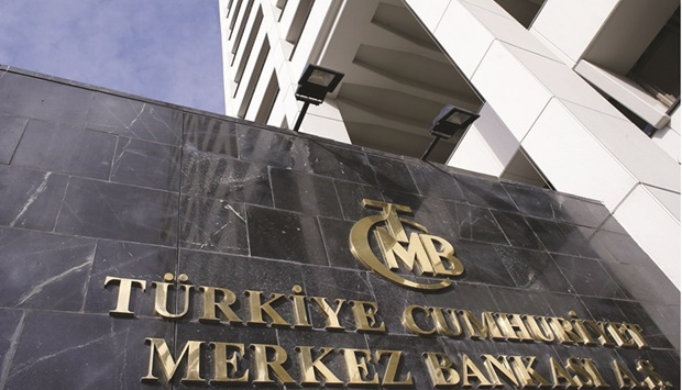 Turkeyu2019s central bank headquarters is seen in Ankara. The Monetary Policy Committee, led by governor Sahap Kavcioglu, held its one-week repo rate at 14% as forecast by all 20 analysts surveyed by Bloomberg, in its first meeting since inflation hit a record 36.1%.