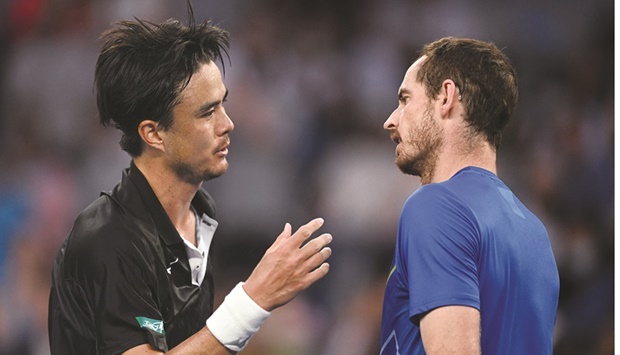 Britainu2019s Andy Murray (right) congratulates Japanu2019s Taro Daniel after their  second round match at the Australian Open in Melbourne yesterday. (Reuters)