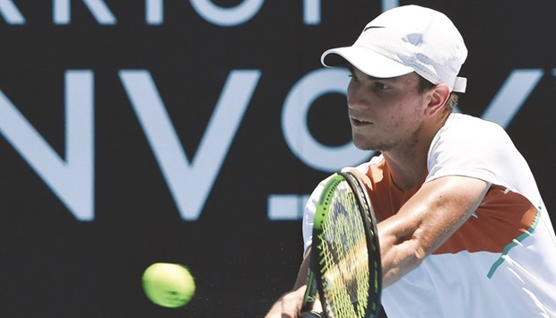 Serbiau2019s Miomir Kecmanovic plays a backhand during his third round match against Italyu2019s Lorenzo Sonego at Australian Open in Melbourne yesterday. (AFP)
