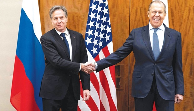 Blinken (left) and Lavrov shake hands before their meeting yesterday in Geneva.