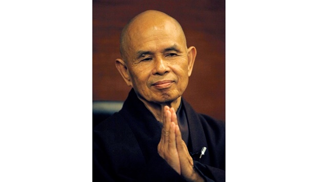 Thich Nhat Hanh gestures during his arrival at Suvarnabhumi airport in Bangkok October 11, 2010. REUTERS
