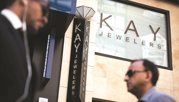 Pedestrians pass in front of a Kay Jewelers store in New York. A surge in diamond demand that began in the early Covid lockdowns is showing no sign of easing, and now even the cheapest, smallest stones are getting caught up in a buying frenzy.