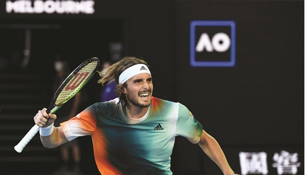 Greeceu2019s Stefanos Tsitsipas celebrates after his victory against Franceu2019s Benoit Paire in the third round of the Australian Open in Melbourne yesterday. (AFP)