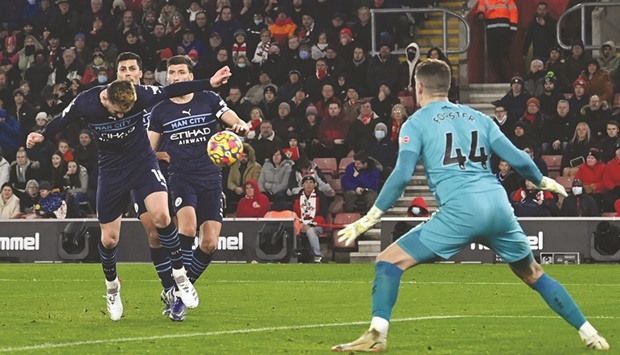 Manchester Cityu2019s French defender Aymeric Laporte (left) heads home their first goal during the English Premier League match against Southampton at St Maryu2019s Stadium in Southampton, southern England, yesterday. (AFP)