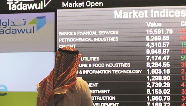 A Saudi investor monitors share prices at the Saudi Stock Exchange, or Tadawul, in the capital Riyadh (file). The Tadawul All Share Index is up 8% this year, making it one of the worldu2019s best performers, data compiled by Bloomberg show.