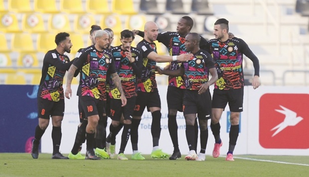 Umm Salal players celebrate their victory over Al Shamal in the QNB Stars League match on Sunday.