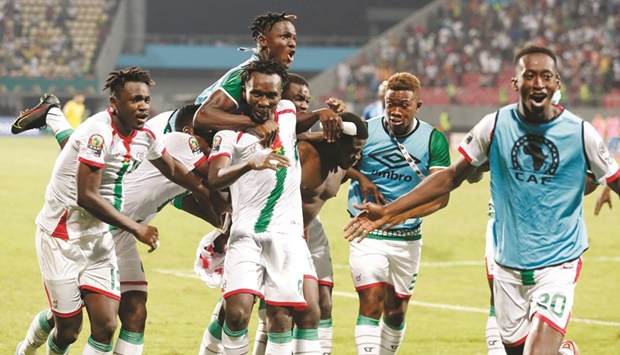 Burkina Faso players celebrate after winning the penalty shoot-out against Gabon during their Africa Cup of Nations, Round of 16 clash, in Limbe, Cameroon, yesterday. (Reuters)