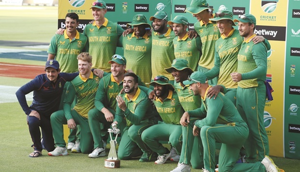 South Africa players celebrate with the trophy after beating India in the third ODI in Cape Town yesterday. (Reuters)