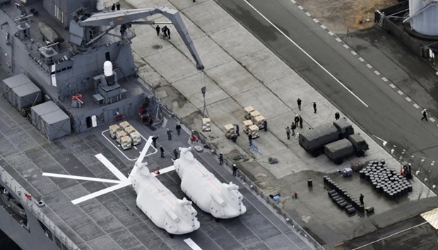 Relief supplies bound for Tonga are loaded onto the Japan Maritime Self-Defense Force's transport vessel Osumi at its base in Kure, Hiroshima Prefecture, Japan . Kyodo/via REUTERS