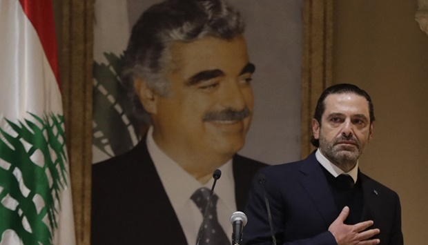 Lebanon's former prime minister Saad Hariri, who was propelled into politics by his father Rafik's assassination in 2005, gestures to the crowd after a press conference in the capital Beirut on January 24, 2022.